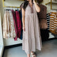 This brown cap sleeve dress features a textured striped pattern enhanced by tiered ruffle flutter sleeves with contrast accent binding detail for a refined look. Crafted from lightweight woven fabric, it offers a comfortable, non-sheer feel and includes convenient side pockets. Fully lined for added comfort and modesty, this dress combines style and functionality with expert design elements.

Entro