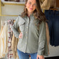 Model wearing a sea spray green French terry shacket with a collar, button front and chest flap pockets.