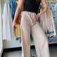 These Mocha Woven Wide Leg Pants are a stylish and comfortable addition to any wardrobe. Made with high quality woven crepe fabric, they feature an elastic band waist and drawstring waistband for a perfect fit. The side pockets add convenience and functionality to these cropped pants. Perfect for any casual or dressy occasion!