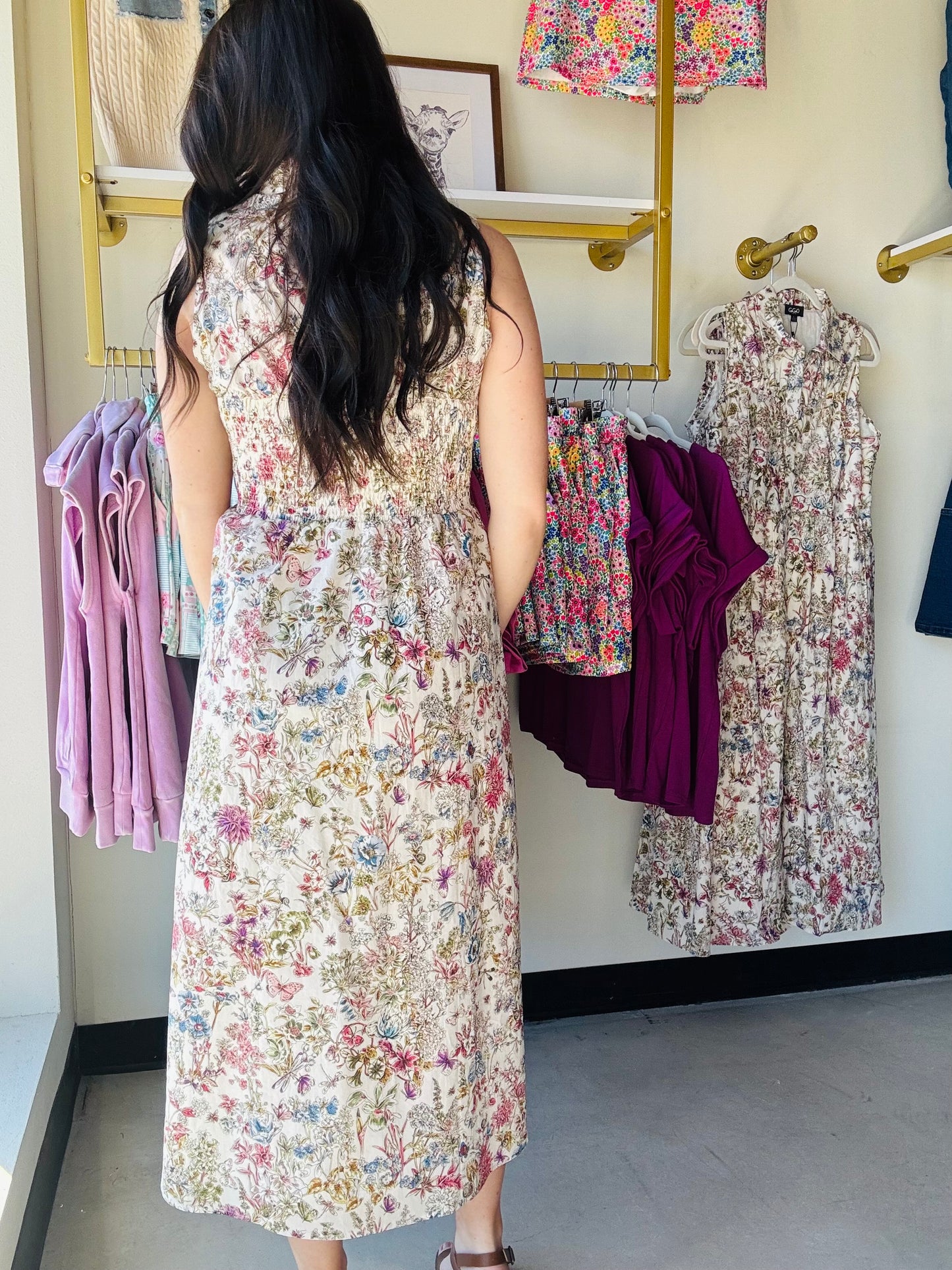 Gigio

Effortless elegance meets botanical charm in this sleeveless midi dress. Featuring a flattering sweetheart neckline and smocked back detailing, this piece offers both comfort and style. The garden print brings a fresh, feminine touch while the fully lined construction ensures a polished look. Perfect for warm-weather occasions, from casual outings to garden parties.