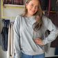 A classic crewneck with a sweet little surprise. The Micro Floral Elbow Patch Crewneck by Staccato takes an easy long-sleeve sweatshirt and adds floral elbow patches for a detail you notice as you move. Pull it on with jeans for a casual afternoon, or layer it over a collared shirt when you want a touch more polish.

Details to love

Floral elbow patches add a playful accent.
Classic crew neckline and long sleeves.
Micro-brushed sweatshirt finish, as listed in the product details.
By Staccato.
Style &amp; s