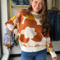 The Floral Intarsia Crewneck Sweater by Doe &amp; Rae is a statement piece that does the talking for you. A bold floral intarsia knit design in a retro-inspired color palette makes this oversized sweater an instant wardrobe standout — the kind you throw on and feel put-together without even trying.

Crafted from a soft 50% Viscose, 28% Polyester, 22% Nylon blend, the medium-weight knit is perfect for layering through transitional seasons or wearing solo on cooler days.

Bold floral intarsia knit in ret