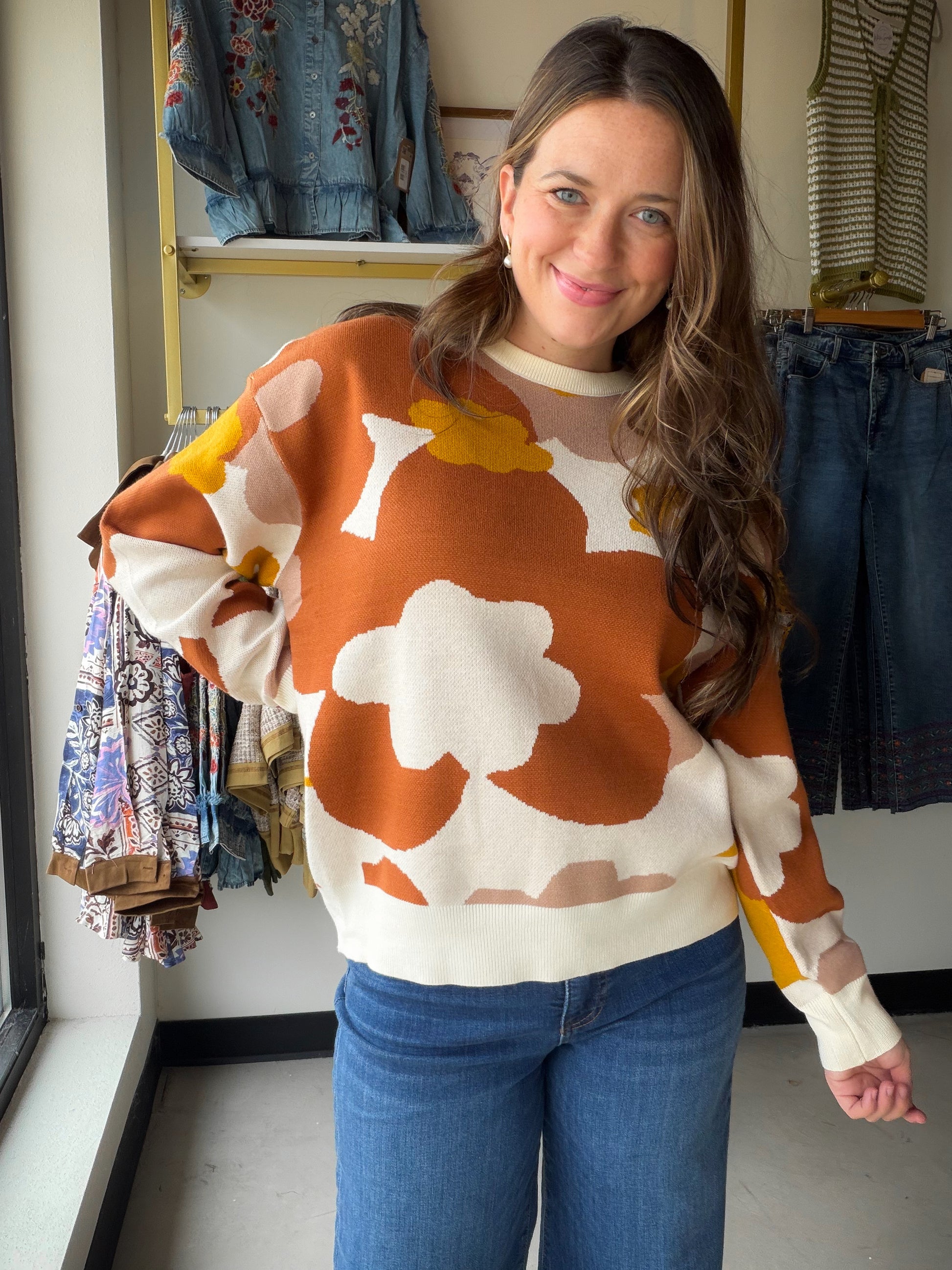 The Floral Intarsia Crewneck Sweater by Doe &amp; Rae is a statement piece that does the talking for you. A bold floral intarsia knit design in a retro-inspired color palette makes this oversized sweater an instant wardrobe standout — the kind you throw on and feel put-together without even trying.

Crafted from a soft 50% Viscose, 28% Polyester, 22% Nylon blend, the medium-weight knit is perfect for layering through transitional seasons or wearing solo on cooler days.

Bold floral intarsia knit in ret