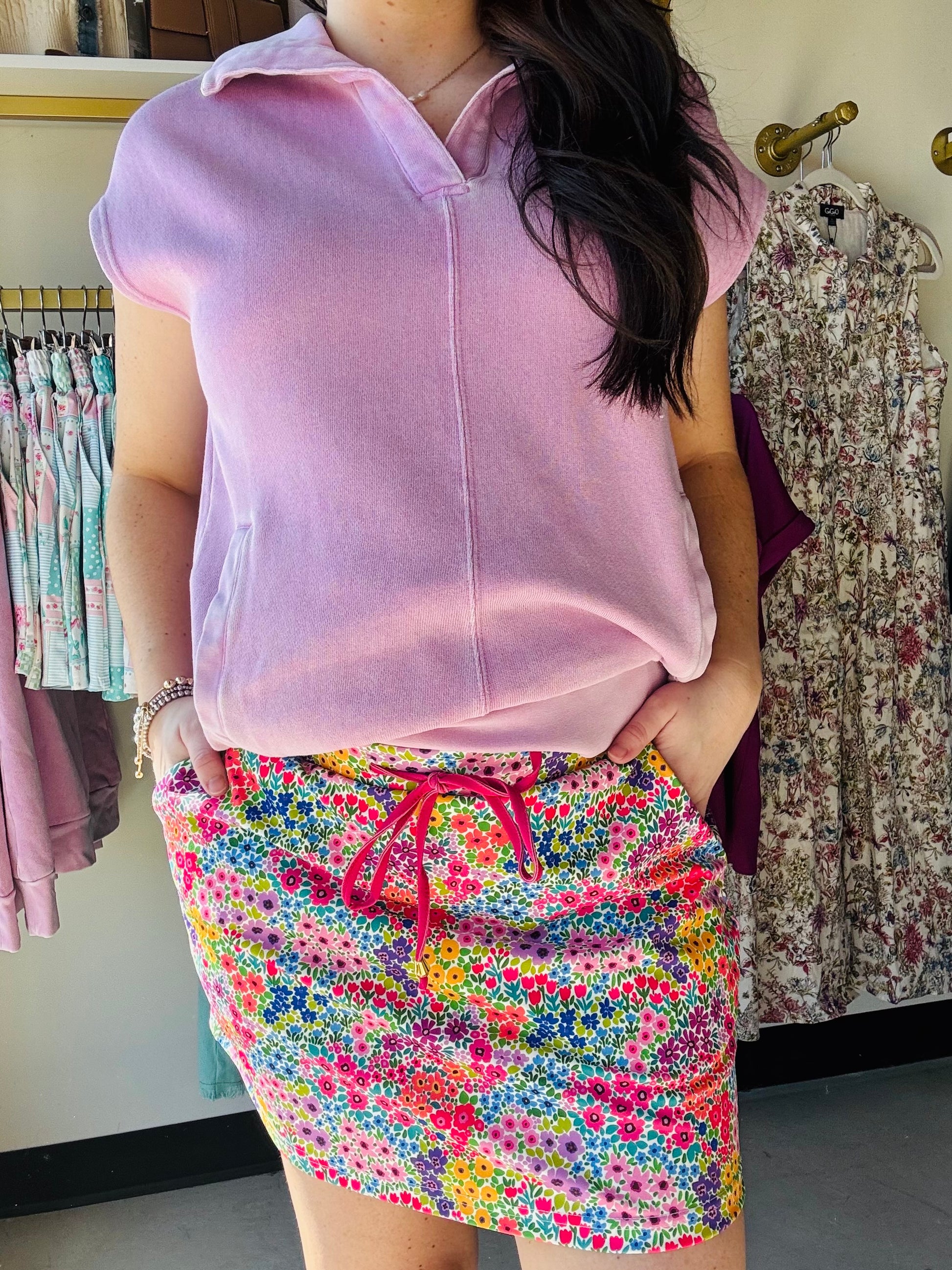 Jess Lea

Embrace the season in this charming skort that captures all the spring energy you need! Adorned with delicate, multicolored florals, it's the perfect blend of cute and comfortable. The breathable, lightweight fabric keeps you cool, while the stretchy back waistband ensures an effortless fit that moves with you. Built-in shorts mean zero wardrobe worries, and handy side pockets plus an adjustable drawstring add both style and function. Your new go-to piece for sunny days ahead!
