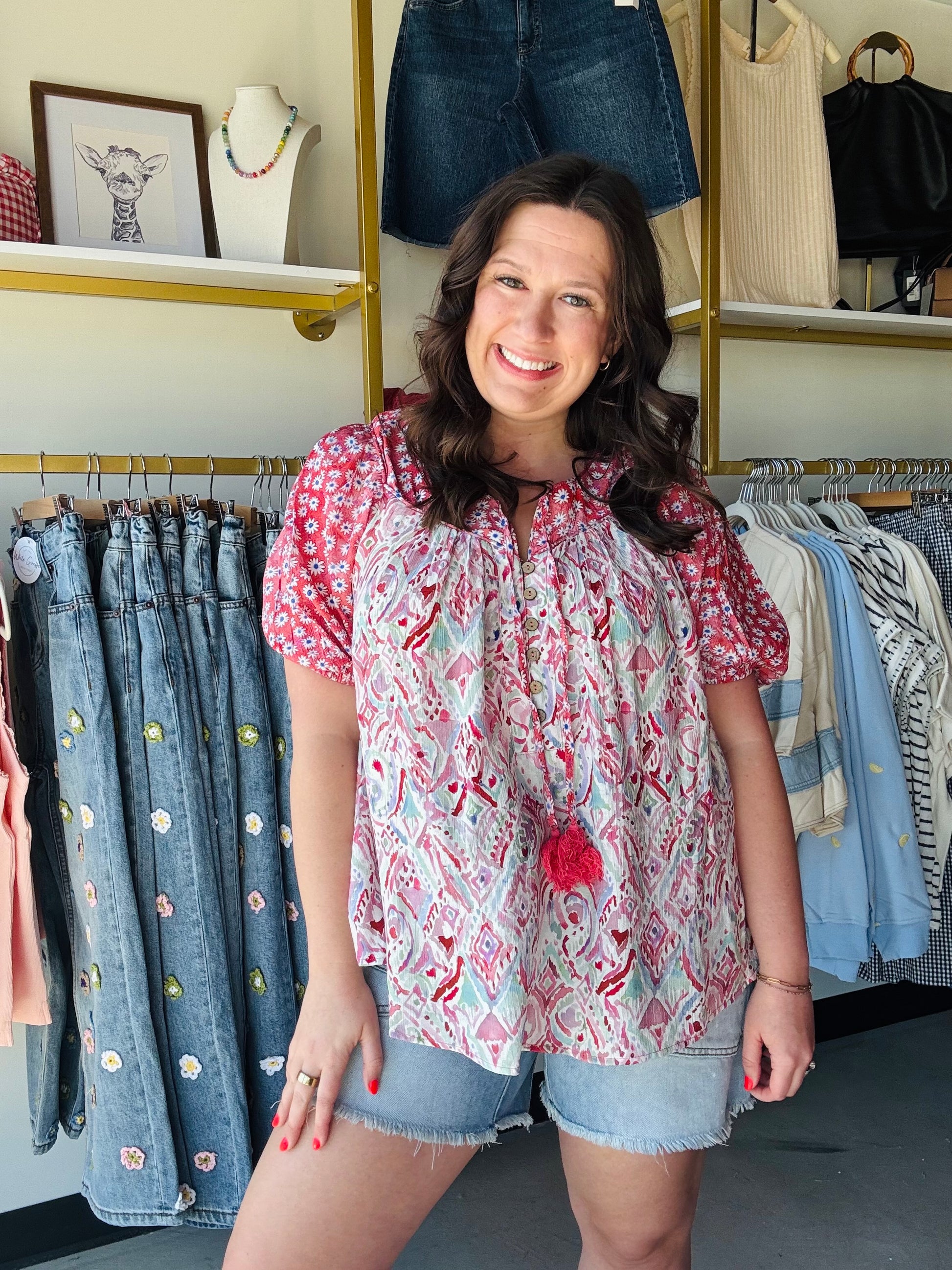 Oli &amp; Hali

Radiate effortless boho charm in this vibrant Oli &amp; Hali mixed-print blouse featuring romantic puff sleeves and playful tassel details. Crafted from a breathable, lightweight blend, its flattering relaxed fit ensures you stay cool and stylish from brunch to sunset.

Flattering relaxed fit for effortless style.
Dramatic puff sleeves add romantic flair.
Vibrant strawberry floral mixed-print design.
Playful tassel ties and button front.
Breathable rayon blend for all-day comfort.
Authentic 