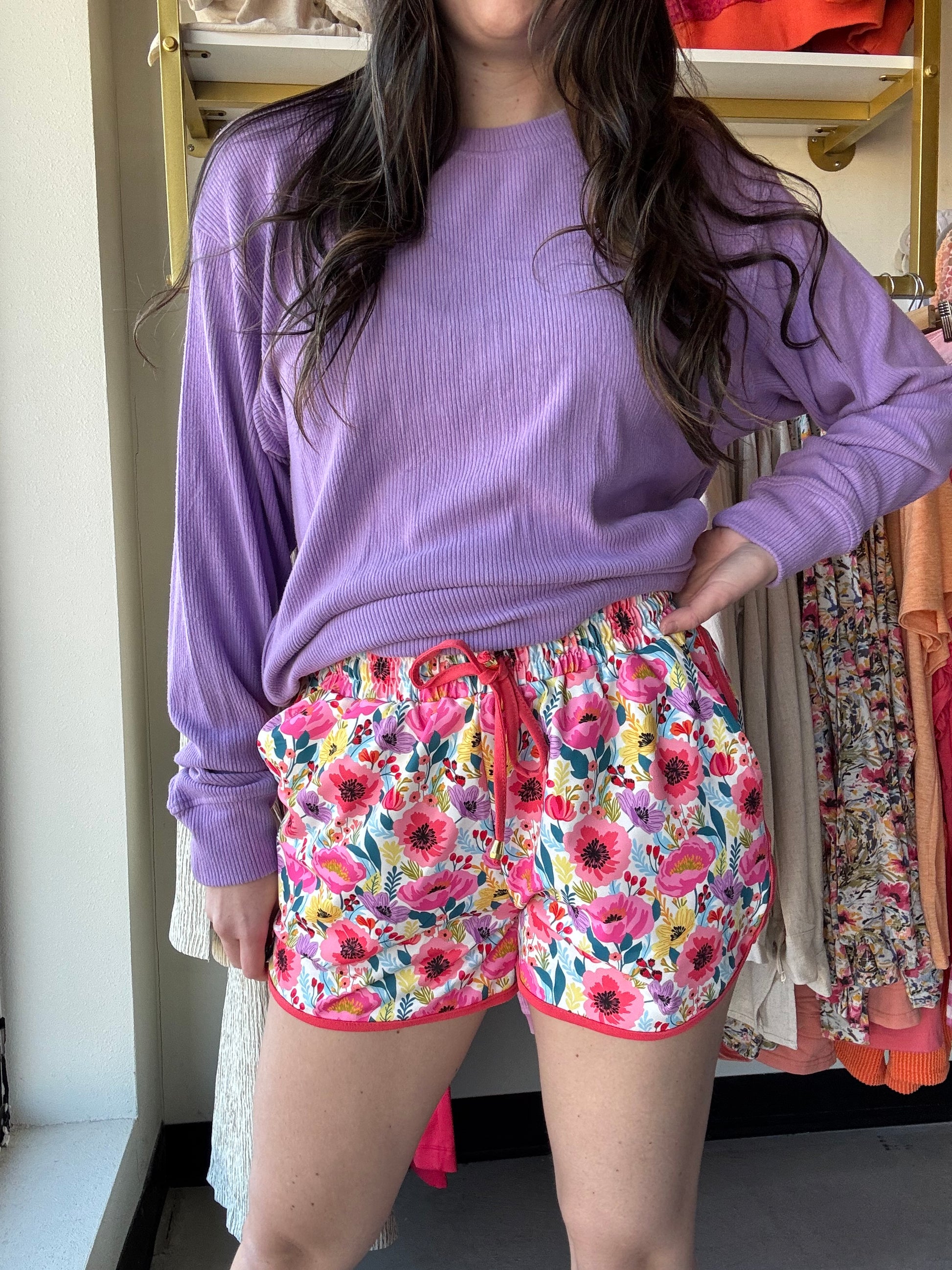 Jess Lea

These mid-rise floral pattern shorts are so perfect for the spring and summer and even to wear into the fall! Get the effortless yet chic look with these shorts. They feature a mid-rise, tie waist drawstring, &amp; side pockets. These are a relaxed fit.