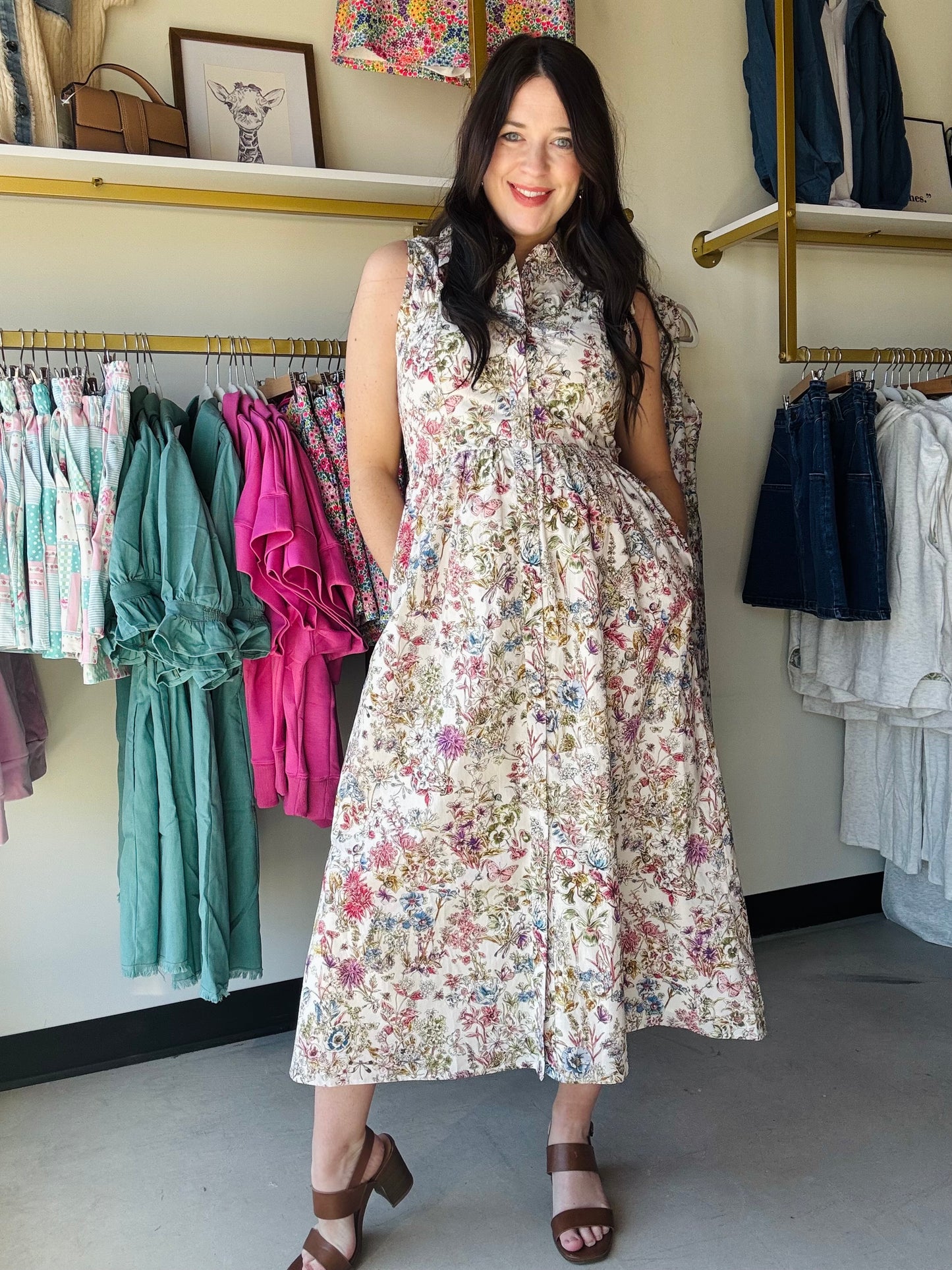 Gigio

Effortless elegance meets botanical charm in this sleeveless midi dress. Featuring a flattering sweetheart neckline and smocked back detailing, this piece offers both comfort and style. The garden print brings a fresh, feminine touch while the fully lined construction ensures a polished look. Perfect for warm-weather occasions, from casual outings to garden parties.