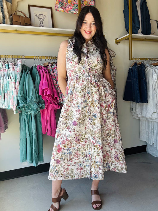 Gigio

Effortless elegance meets botanical charm in this sleeveless midi dress. Featuring a flattering sweetheart neckline and smocked back detailing, this piece offers both comfort and style. The garden print brings a fresh, feminine touch while the fully lined construction ensures a polished look. Perfect for warm-weather occasions, from casual outings to garden parties.