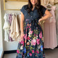 Navy Mix Floral Tie Waist Dress

A print-forward dress that means business — in the best way. This floral shirt dress features a flattering tie waist, bronze button details, and cuffed roll sleeves for a polished yet relaxed look. Fully lined and crafted in a flowy rayon blend, it transitions effortlessly from a day out to an evening event.

Floral print on a navy mix base
Shirt dress silhouette with tie waist
Bronze button details down the front
Cuffed roll sleeves
Fully lined
83% Rayon, 17% Nylon — lightw