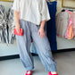 Gigio

Experience the ultimate fusion of coastal ease and modern streetwear. These navy pinstripe parachute pants feature charming wood buttons and a gathered ankle for a look that’s as breathable as it is chic.


Chic navy pinstripe for timeless style
Relaxed parachute fit for all-day ease
Adjustable drawstring for the perfect fit
Gathered ankles for a modern silhouette
Functional pockets with wood button detail
Breathable fabric for effortless cool comfort

