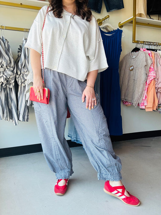 Gigio

Experience the ultimate fusion of coastal ease and modern streetwear. These navy pinstripe parachute pants feature charming wood buttons and a gathered ankle for a look that’s as breathable as it is chic.


Chic navy pinstripe for timeless style
Relaxed parachute fit for all-day ease
Adjustable drawstring for the perfect fit
Gathered ankles for a modern silhouette
Functional pockets with wood button detail
Breathable fabric for effortless cool comfort
