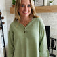 Our Green Button Confetti Sweater is the perfect statement piece this season. It features striking flecks of color in the fabric, a rolled up sleeve with button detailing, and a slightly oversized fit. With a versatile design, this sweater pairs easily with white denim for a unique, stylistic look.