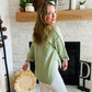 Our Green Button Confetti Sweater is the perfect statement piece this season. It features striking flecks of color in the fabric, a rolled up sleeve with button detailing, and a slightly oversized fit. With a versatile design, this sweater pairs easily with white denim for a unique, stylistic look.