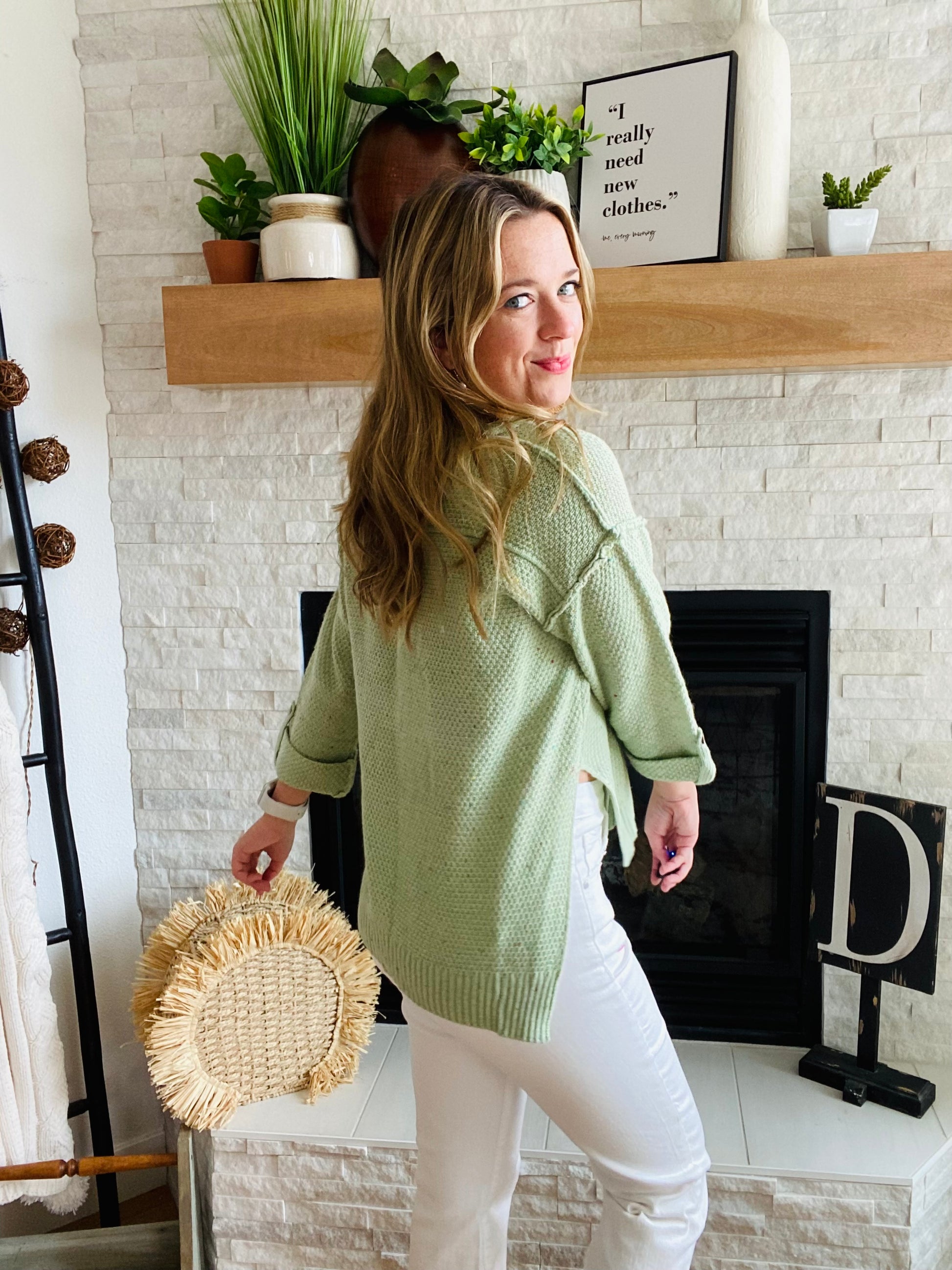 Our Green Button Confetti Sweater is the perfect statement piece this season. It features striking flecks of color in the fabric, a rolled up sleeve with button detailing, and a slightly oversized fit. With a versatile design, this sweater pairs easily with white denim for a unique, stylistic look.