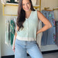 Meet your new warm-weather layering essential. The Ivory &amp; Green Stripe Sweater Vest from Staccato is a chic, effortless piece that pairs beautifully over a crisp button-down, a flowy blouse, or your favorite tee.

A classic V-neck and sleeveless silhouette keep things polished and versatile, while the button-down front adds a relaxed, put-together finish. The soft ivory and green stripe pattern brings a fresh, feminine touch to any outfit.

V-neck, button-down, sleeveless sweater vest cardigan
60% Cott