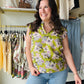 Staccato

Embrace effortless elegance with this breezy Staccato floral blouse, featuring feminine flutter sleeves and a sophisticated ruffle collar. Crafted from lightweight woven fabric, the flattering v-neck and pleated back detail create a chic silhouette perfect for any occasion. Elevate your everyday style with this must-have botanical print top.

Chic ruffle collar and V-neck.
Feminine flutter sleeves add movement.
Elegant pleated back for drape.
Lightweight, breathable woven fabric.
Versatile olive a