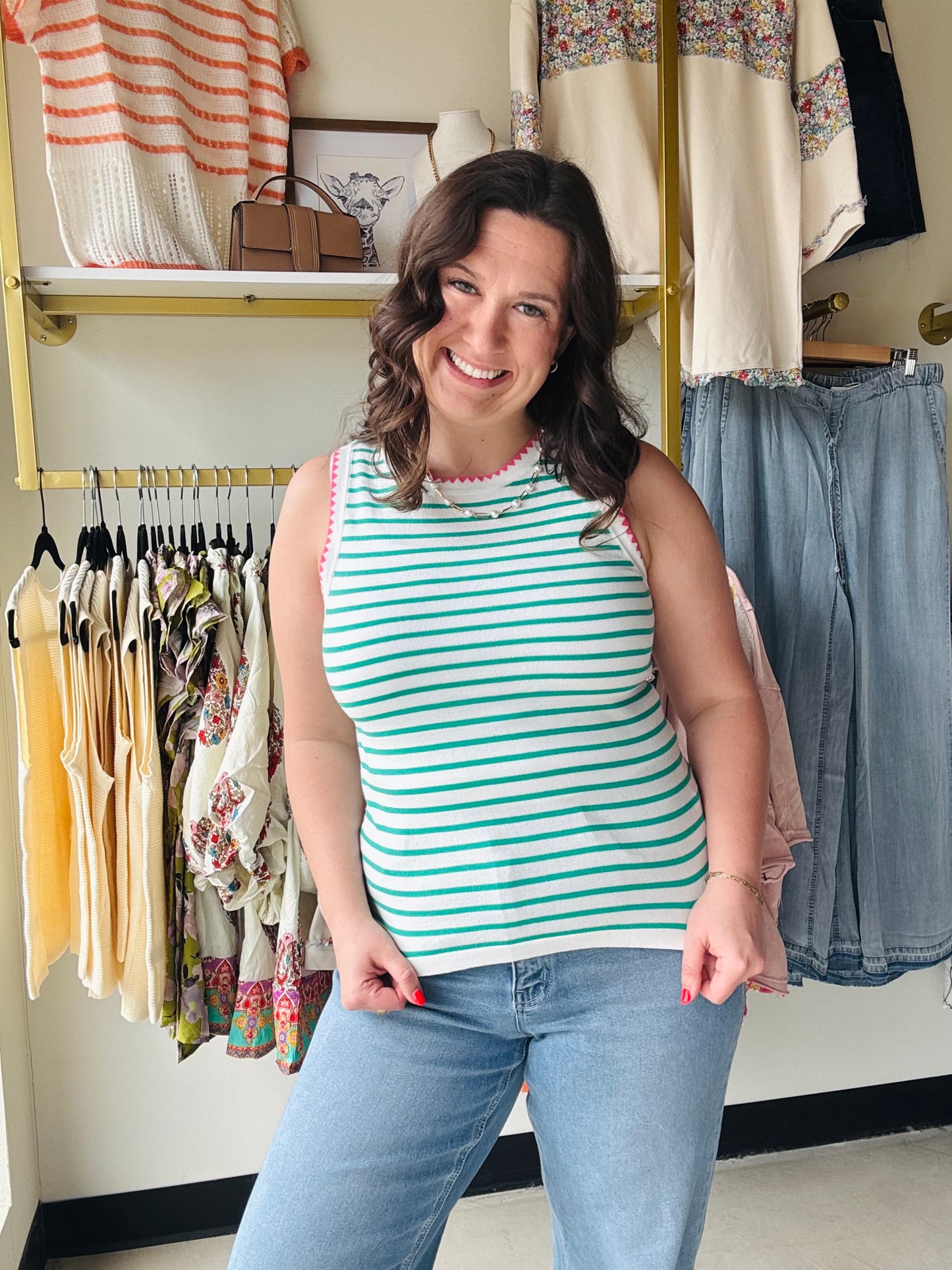 Staccato

Refresh your summer wardrobe with this chic, breathable knit tank. Featuring vibrant green stripes and a playful pink scalloped trim, it offers the perfect blend of preppy and modern style. This versatile Staccato essential pairs effortlessly with your favorite denim or skirts.

Playful pink scalloped edge trim.
Soft, breathable lightweight knit fabric.
Classic vibrant green and white stripes.
Flattering sleeveless crew neck silhouette.
Versatile for layering or solo wear.
Durable, high-quality St