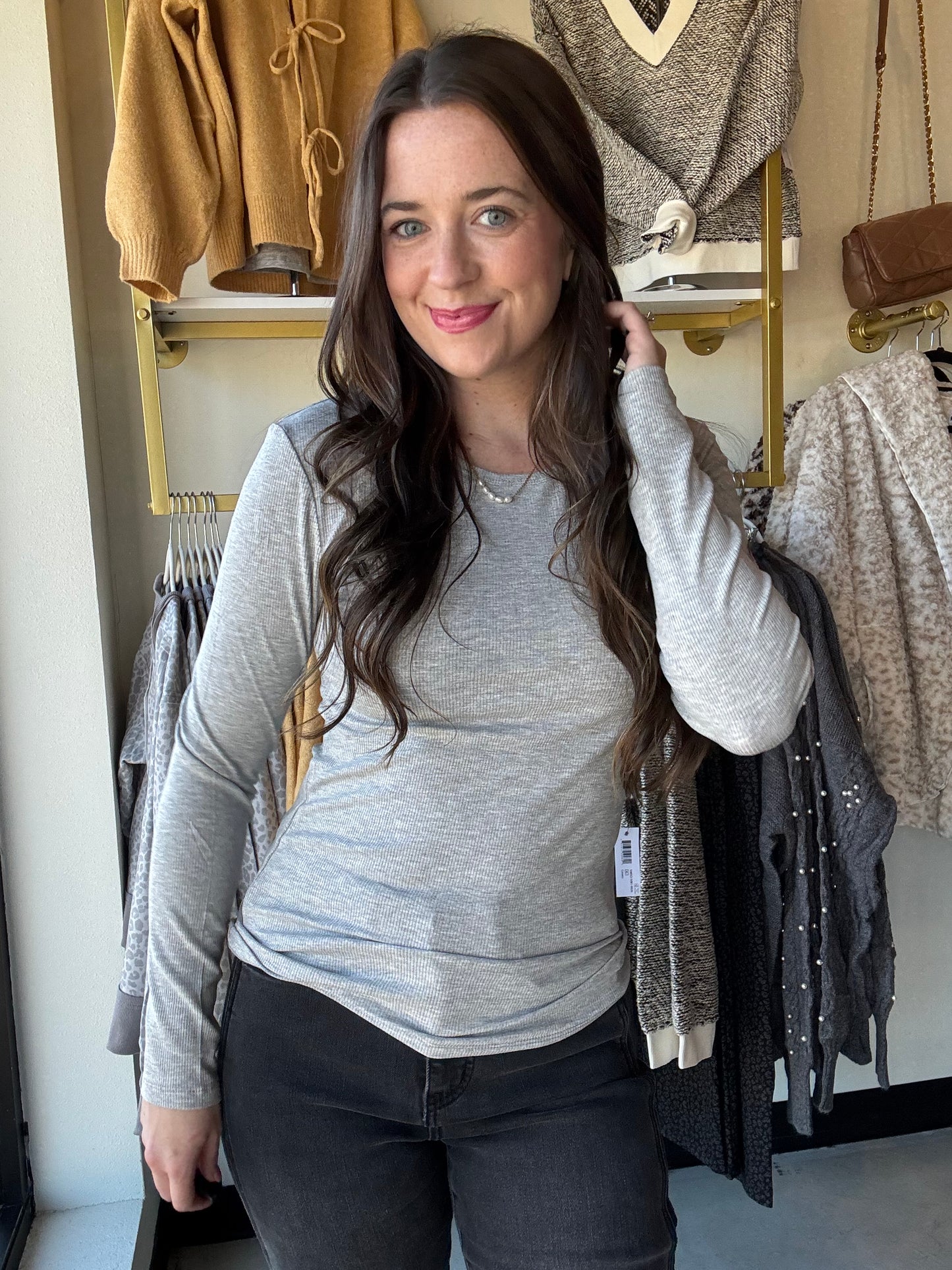 Yelete&nbsp;

Cozy meets cute in this Heather Grey Viscose Long Sleeve tee. Its soft, breathable fabric keeps you comfy all day, while the classic crew neckline adds just the right touch of charm. The fitted silhouette hugs your shape for a flattering look, and those long sleeves are perfect for chillier days or layering fun.&nbsp;