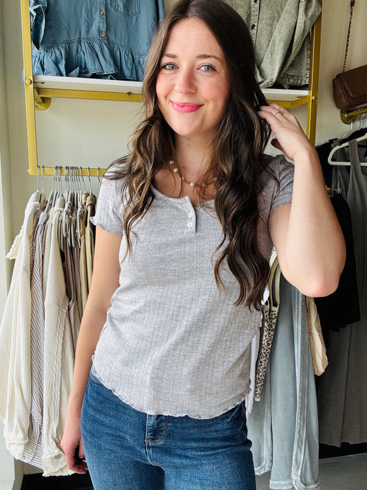 7th Ray

Made in USA

This Heather Grey Pointelle Tee features a delicate pointelle design that adds a touch of charm to your everyday look. The scoopneck neckline offers a flattering fit, while the scalloped sleeves bring a playful, feminine flair. Perfect for layering or wearing on its own, this tee combines comfort with subtle style.