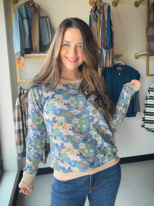 Effortlessly pretty meets everyday comfort. The Blue Hacci Floral Printed Top by Staccato features a soft, stretchy hacci fabric with a delicate floral print that makes it easy to dress up or down. The raglan long sleeve and relaxed crew neck give it a laid-back, flattering fit you'll reach for again and again.

Raglan long sleeve with crew neck
Hacci floral print in blue
Soft, stretchy construction
95% Polyester, 5% Spandex
Available in S, M, L, XL