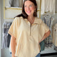 The hoodie, reimagined for warmer days. The Taupe Short Sleeve Hoodie by Bibi gives you all the cozy, laid-back energy of your favorite hoodie — minus the sleeves. It's the perfect transitional piece for those in-between days when you want something casual and comfortable without overheating.

In a versatile taupe tone that pairs with just about everything, this relaxed sweatshirt-style top is an easy grab for errands, coffee runs, or lounging in style. Wear it with biker shorts, denim, or joggers for an ef