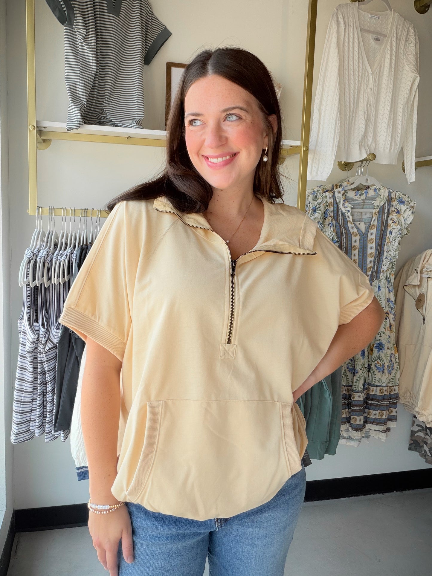 The hoodie, reimagined for warmer days. The Taupe Short Sleeve Hoodie by Bibi gives you all the cozy, laid-back energy of your favorite hoodie — minus the sleeves. It's the perfect transitional piece for those in-between days when you want something casual and comfortable without overheating.

In a versatile taupe tone that pairs with just about everything, this relaxed sweatshirt-style top is an easy grab for errands, coffee runs, or lounging in style. Wear it with biker shorts, denim, or joggers for an ef