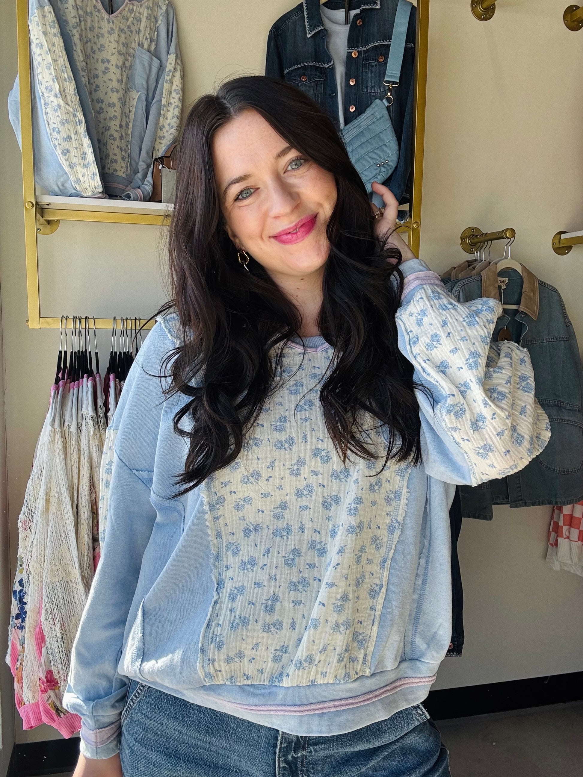 Hem &amp; Thread&nbsp;

This relaxed terry top combines comfort with understated elegance. Crafted from soft cotton, it features a flattering scoop neck, functional front pocket, and exposed hems for a contemporary edge. Delicate floral embroidery in lilac adds a charming detail, while coordinating piping accents the neckline. Perfect for layering or wearing solo, this versatile piece transitions effortlessly from casual days to cozy evenings.