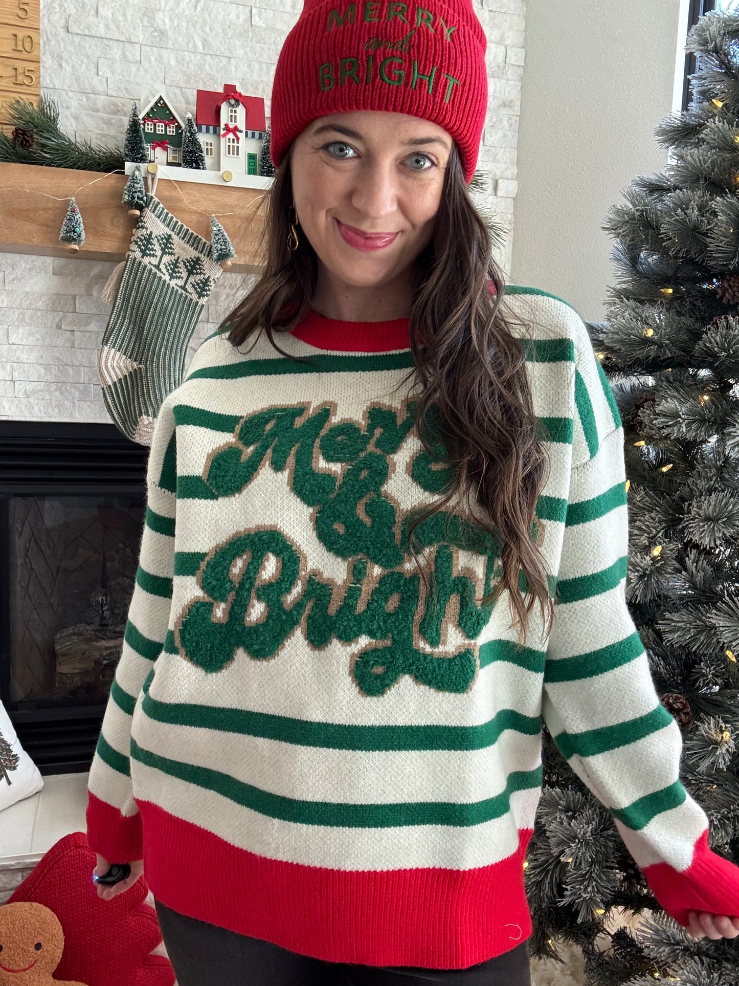 Wrap yourself in holiday cheer with this festive crewneck sweater! Featuring a cozy thick knit perfect for chilly winter days, it showcases vibrant red accents paired with cheerful green stripes that capture the spirit of the season. The playful color combination makes it an instant conversation starter at holiday gatherings. Whether you're decorating, caroling, or cozying up by the fire, this merry &amp; bright sweater brings warmth and festive flair to your seasonal wardrobe.

Bibi