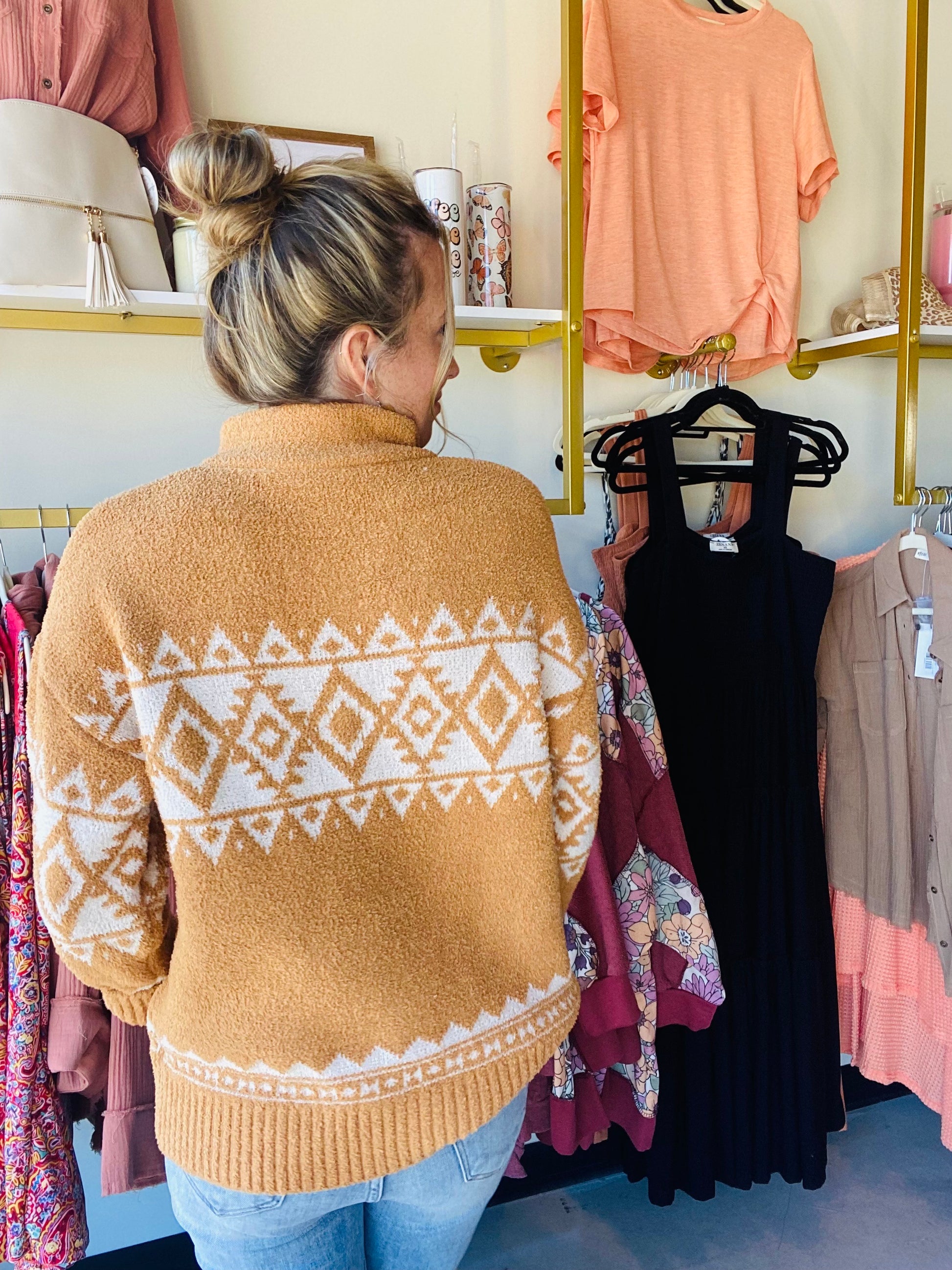 This classic Aztec Tan Zip Pullover boasts a buttery-soft material and a timeless aztec pattern, perfect for adding a cozy touch to your winter wardrobe. Its zip-up collar gives you the option of extra protection on the coldest days.