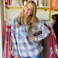 Stay warm and comfortable all winter long with this Blue and Pink Plaid Pullover. Crafted with a super fuzzy fabric and fleece lined hood, this pullover is perfect for running errands or outdoor activities. It also features functioning pockets and stylish buttons to make it both practical and fashionable.