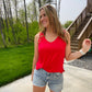 We know we're always on the lookout for a good, comfy basic! This tank is definitely one of those pieces! It's comfy and a relaxed fit that makes it so easy to wear and the neutral colors make styling and layering it a breeze! This top features a sleeveless style, a v-neck neckline, side slits, a back center seam and a rounded, hi-lo hemline.