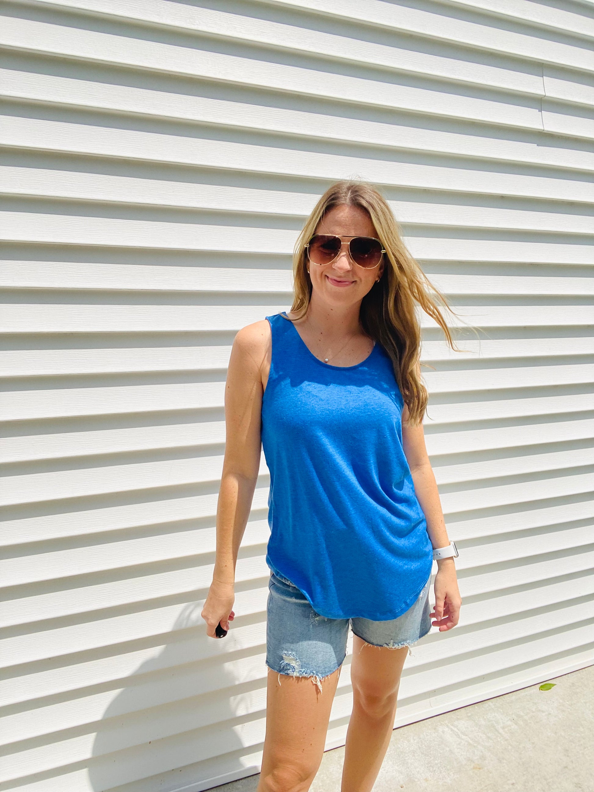The Tiffany Tank is the perfect combination of comfy and trendy. Crafted with a stretchy fabric for ultimate comfort, this tank features a scoop neck and wide straps to ensure a secure fit and bold neon colors to make a statement. Feel fashionable and secure with this essential tank.