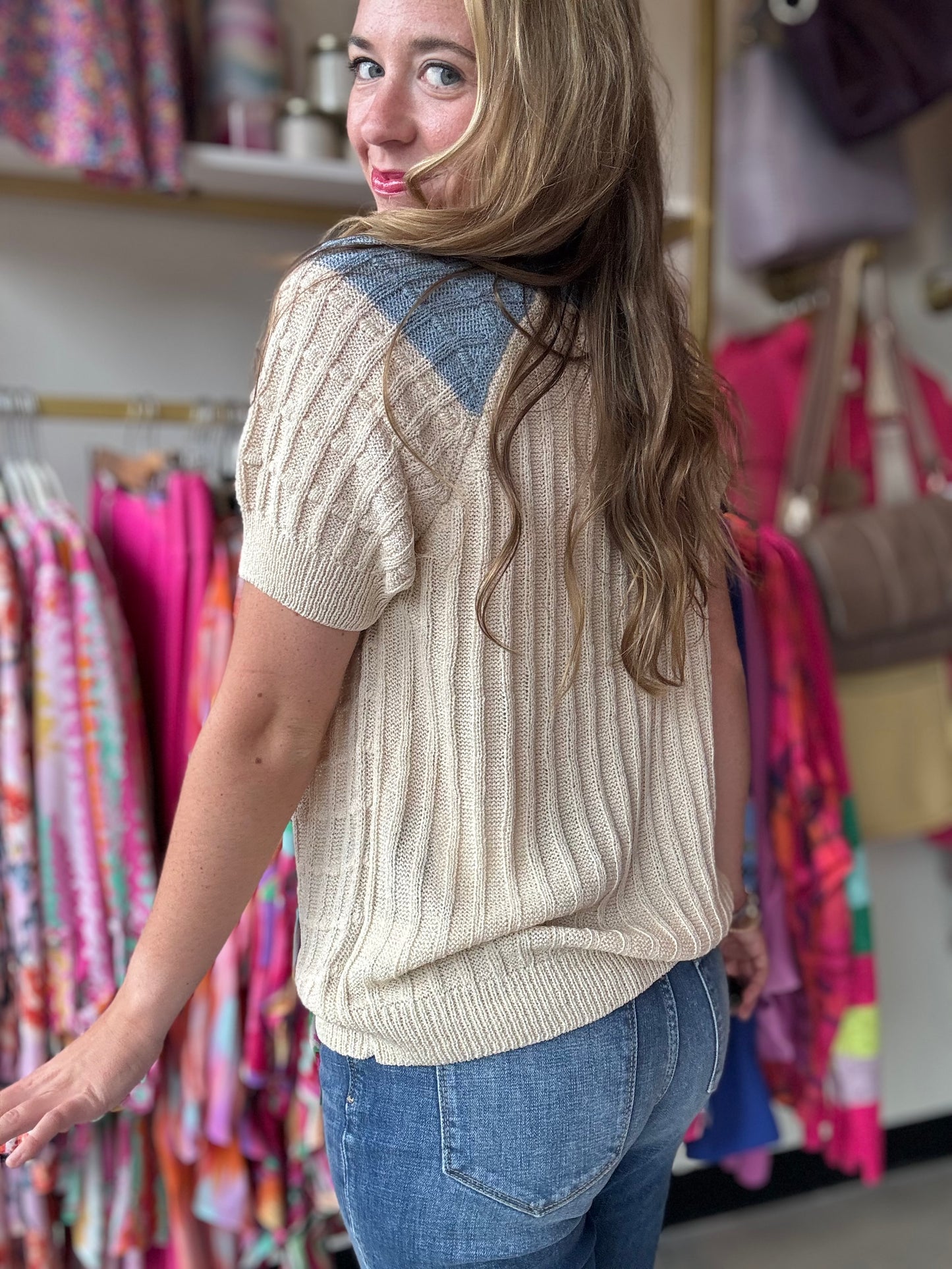 Elevate your wardrobe with our Birdseye Texture Raglan Sweater. In gorgeous blue and cream, this short sleeve sweater flawlessly transitions you from summer to fall. The high neckline and subtle puff sleeve detail add a touch of sophistication, perfect for the office or a coffee date.  Bibi Brand