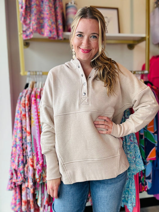 This Heathered Hoodie features a button closure for easy wearing and ribbed cuffs for added comfort. Its relaxed fit allows for easy movement, while kangaroo pockets provide convenient storage. Stay warm and cozy with this fleece hooded pullover.