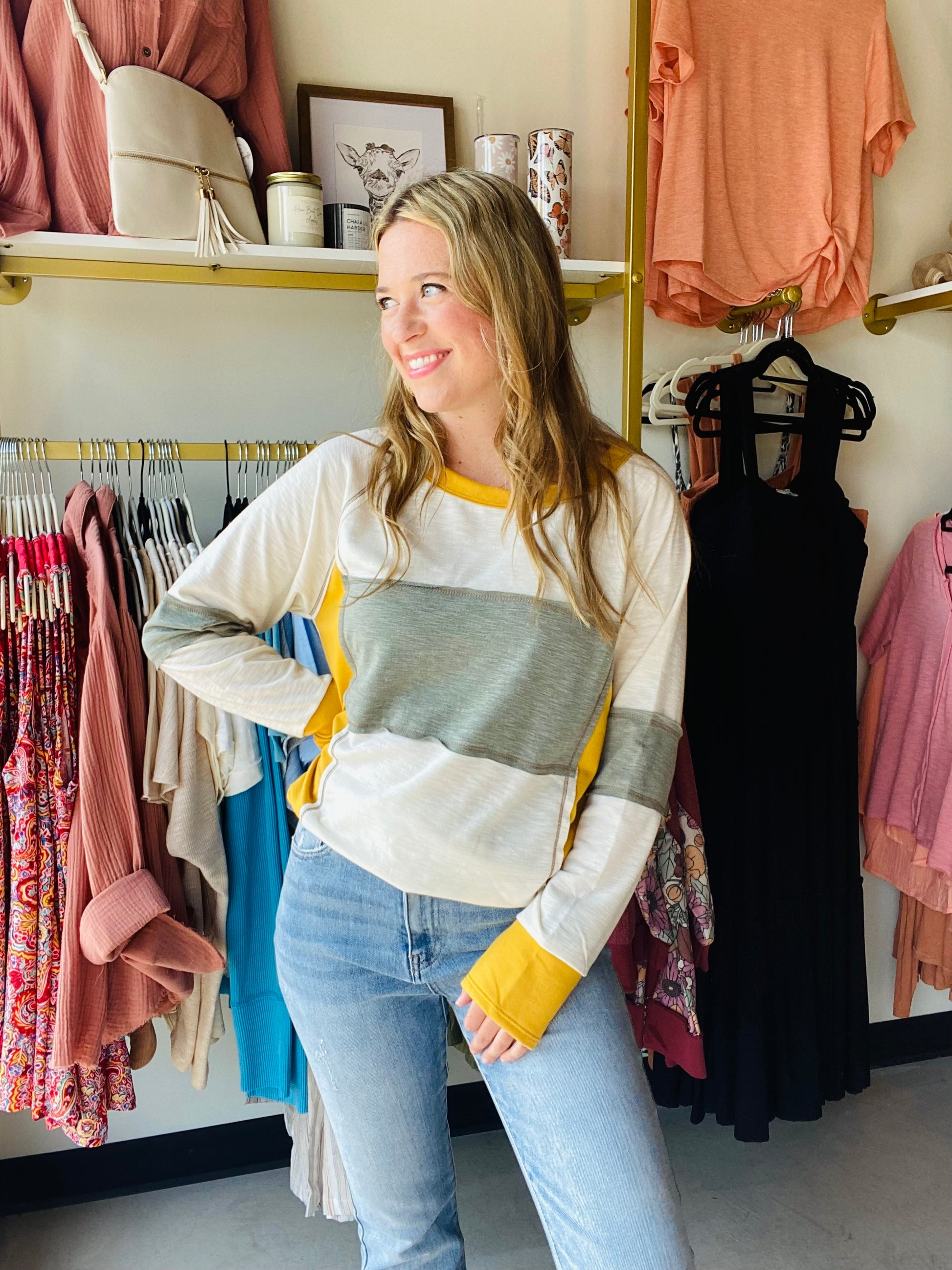 This long sleeve contrast top is the perfect addition to your fall wardrobe. Featuring Packers colors in a lightweight fabric, it has a scoop neckline for a classic look. An essential for any fan and subtle enough to wear out to lunch with your girlfriends.   Bibi Brand 