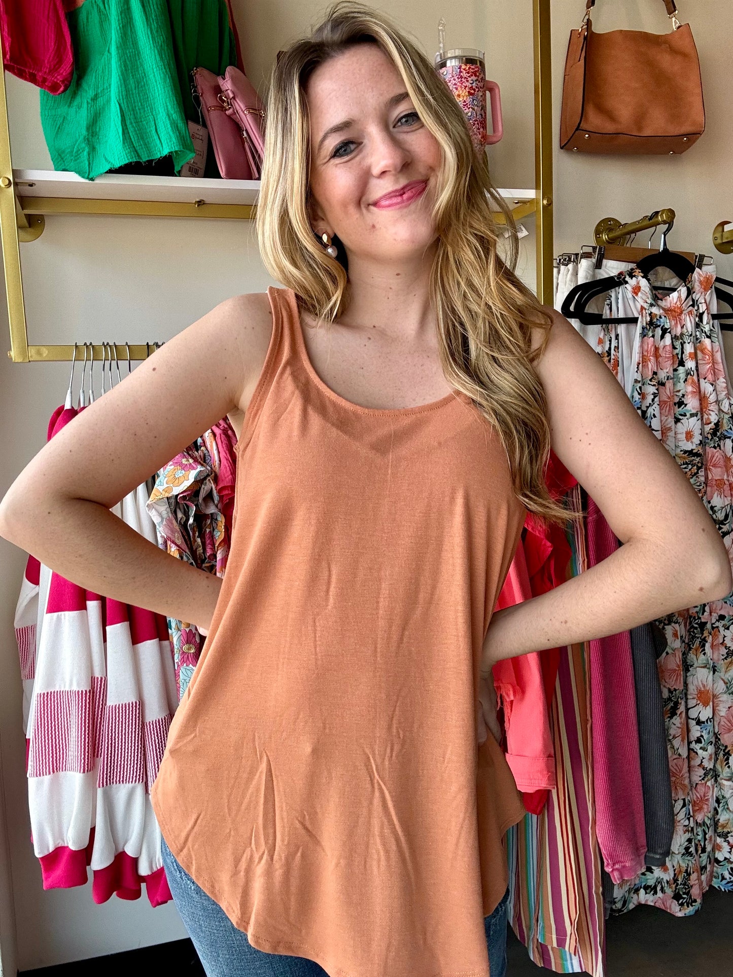 This Rounded Neck Tank is more than just your average top. With its relaxed fit and round hem, it's the perfect tank for any occasion. Made with the best quality, this top will be your go-to piece in your wardrobe.