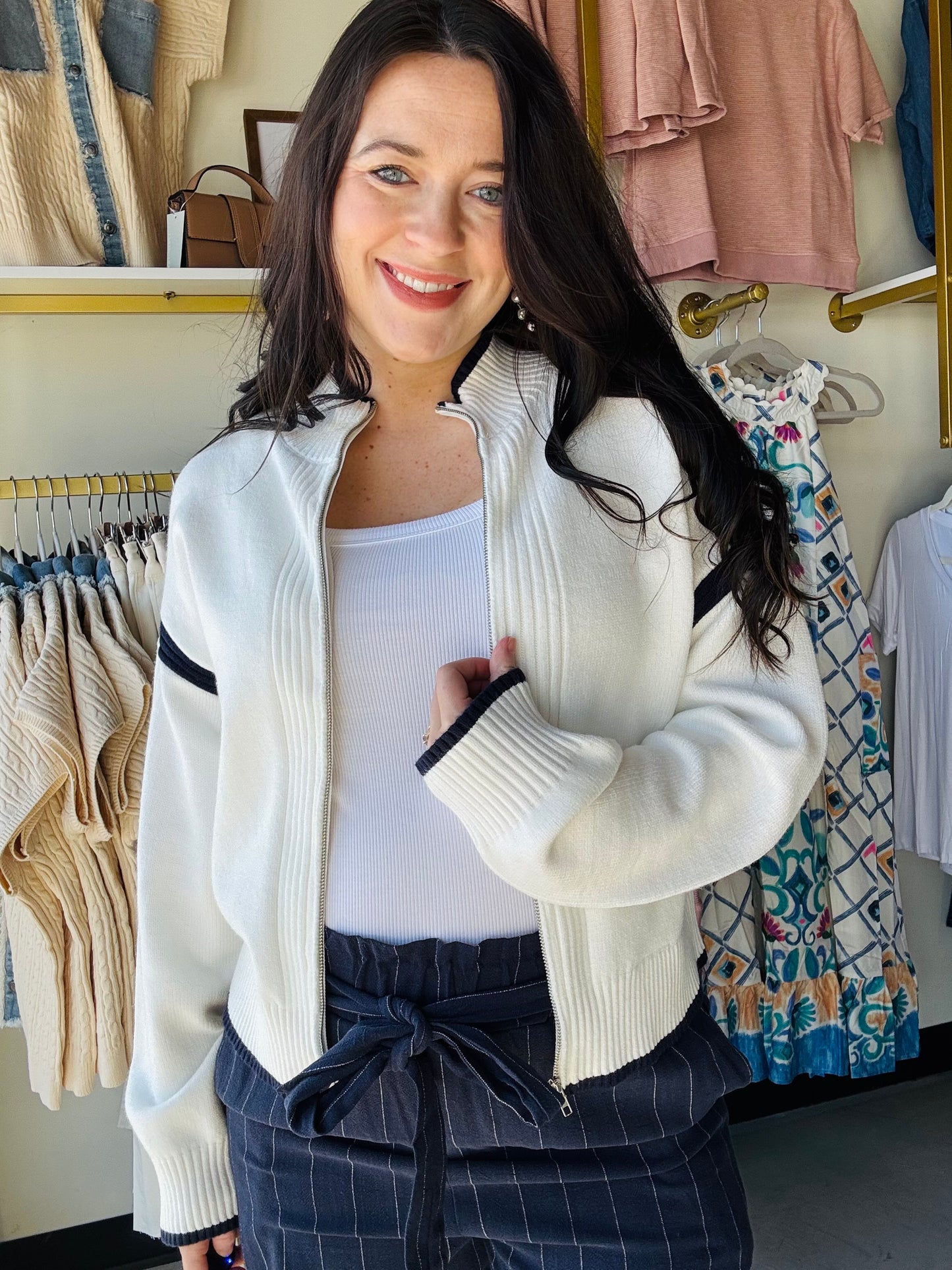 Thread &amp; Supply

So soft and plush with a sporty twist, this sweater jacket is featured in a relaxed fit, drop shoulder and front zip closure with ribbed hem details.

Full zipper front closure
Drop shoulder
Measurements for a size small:

Length: 21.5"&nbsp;
Chest: 19"
Sweep: 19"
Sleeve length: 20"
Fabric Content/Care:&nbsp;

51% Viscose
29% Polyester
20% Nylon
Machine Wash Cold