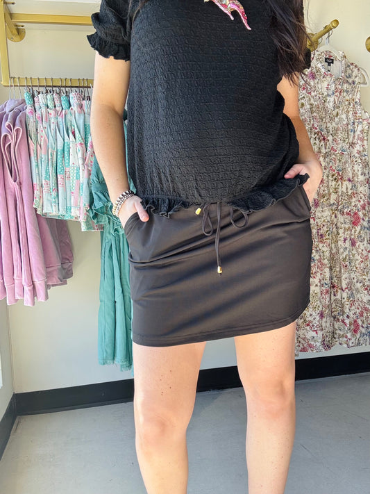 Jess Lea

Start a style conversation with this playful solid colored skort. Made with lightweight fabric, it features an elastic band on the back and built-in shorts to keep you comfortable yet totally on-trend. Side pockets and a drawstring add a practical finishing touch to the fun vibe. Get ready to check out with this skort!