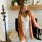 Stay cozy in style with the Khaki Side Slit Hooded Cardi! Made with a comfy stretchy fabric and a hood, it's the perfect go-to piece to keep yourself feeling relaxed and looking cool. The balloon sleeve accent adds a unique touch, while the side slit makes it oh-so-easy to throw on and wear all day. Stay warm, stay chic!