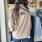 Embrace cozy vibes with the Khaki Denim Accent Pullover, featuring a mineral-washed finish for that perfectly lived-in look. This oversized, relaxed-fit pullover delights with contrast floral trim and a playful partial button-up front. Dropped shoulders and a collared neckline add casual charm, while a button-flap patch pocket on the sleeve adds a quirky touch. Perfect for layering or lounging in style!
