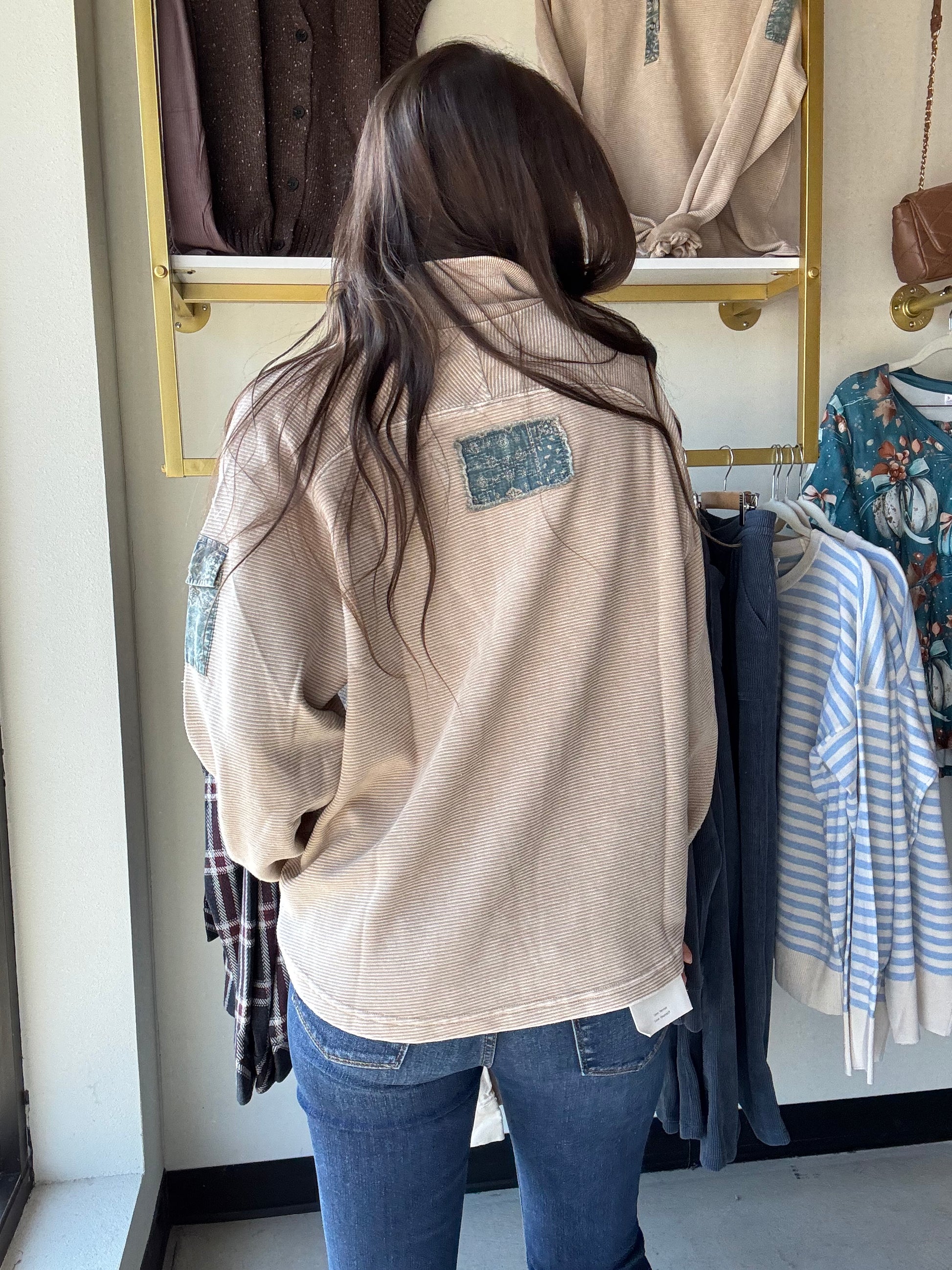Embrace cozy vibes with the Khaki Denim Accent Pullover, featuring a mineral-washed finish for that perfectly lived-in look. This oversized, relaxed-fit pullover delights with contrast floral trim and a playful partial button-up front. Dropped shoulders and a collared neckline add casual charm, while a button-flap patch pocket on the sleeve adds a quirky touch. Perfect for layering or lounging in style!
