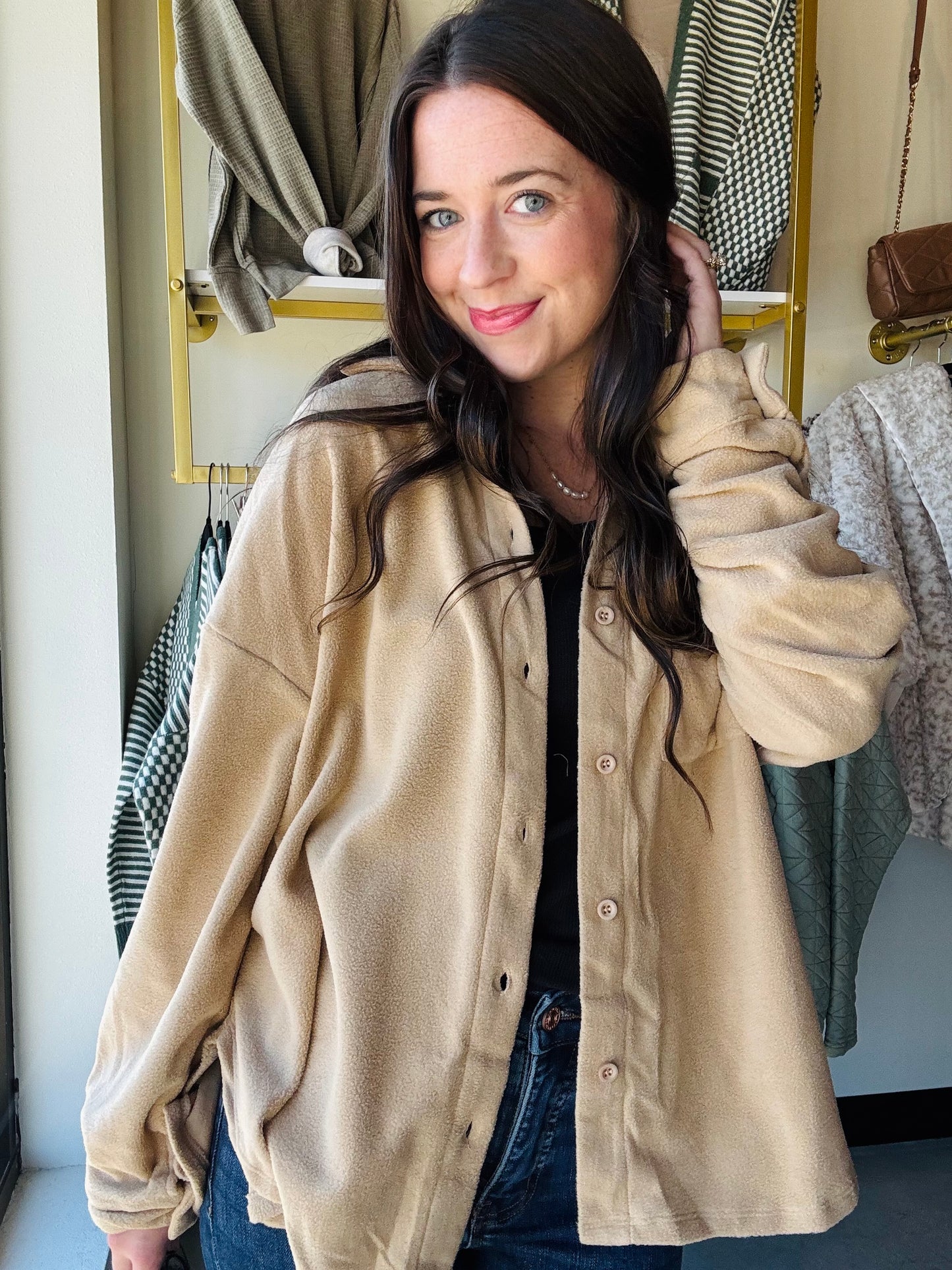 Crafted from a breathable, lightweight fabric, this top features a classic collar that frames the neckline beautifully, and button-down detailing for a polished look. Its soft, tailored fit flatters any silhouette, while long sleeves add a touch of warmth for cooler days.