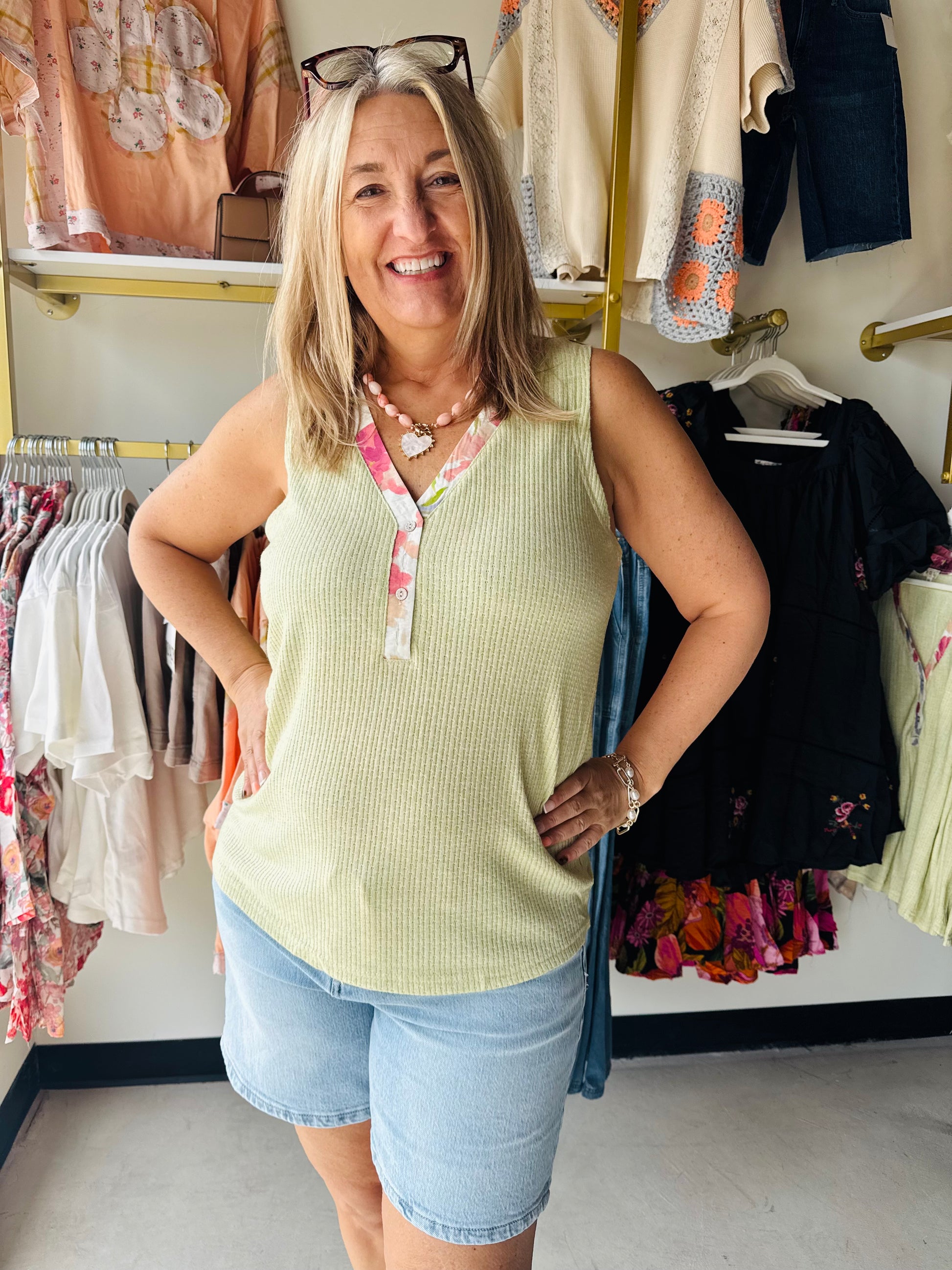 POL

Elevate your everyday basics with this ultra-soft, textured knit tank featuring a delicate floral-trim V-neck and functional henley buttons. Designed for a relaxed, breezy fit, it offers the perfect blend of feminine charm and effortless comfort for any sunny-day outing.

Soft textured knit for all-day comfort.
Effortless, relaxed fit for every body.
Charming floral-trim V-neck detail.
Functional button-front henley style.
Lightweight fabric perfect for layering.
Versatile design for effortless styling