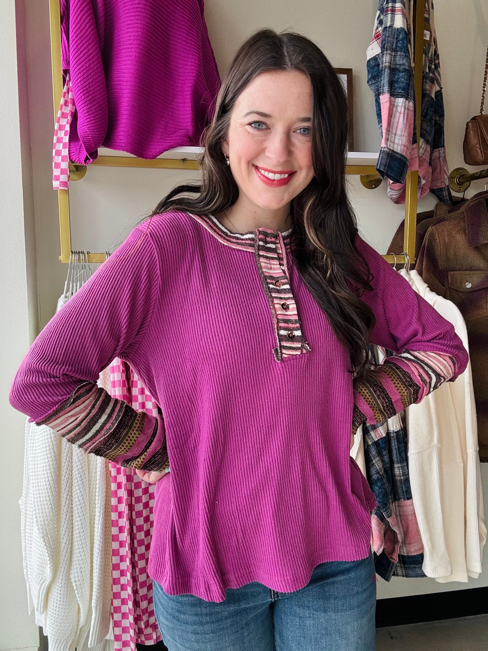 Jodifl

Get cozy and stylish with our Magenta Rib Knit Henley. You'll love the super soft material and button up detail, while the stripe sleeve and collar add a touch of flair. Perfect for chilly days, this long sleeve tee will quickly become your go-to choice for both comfort and style.