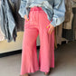 Easel

Experience the perfect fusion of laid-back luxury and vintage boho style with these ultra-soft mineral-washed terry knit pants. Featuring a trendy wide-leg silhouette and raw edge detailing, these high-impact loungewear essentials offer an effortless, lived-in look for the modern trendsetter.

Mineral-washed for vintage, lived-in softness.
Relaxed wide-leg fit for effortless movement.
Soft terry knit ensures all-day comfort.
Adjustable drawstring creates the perfect fit.
Large patch pockets for funct