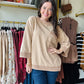 Easel

This Mocha Knit Pocket Crewneck features 3/4 length sleeves and a classic crew neckline for a refined, comfortable fit. The subtle braid detailing adds texture and visual interest, making it a sophisticated choice for fall layering. Perfect for transitioning seasons, this sweatshirt combines effortless style with cozy warmth.