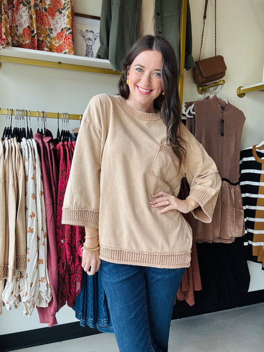 Easel

This Mocha Knit Pocket Crewneck features 3/4 length sleeves and a classic crew neckline for a refined, comfortable fit. The subtle braid detailing adds texture and visual interest, making it a sophisticated choice for fall layering. Perfect for transitioning seasons, this sweatshirt combines effortless style with cozy warmth.