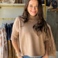 Understated. Elevated. Endlessly wearable. The&nbsp;Mocha Soft Mockneck Sweater by Rain &amp; Rose is the kind of sweater your wardrobe has been waiting for — a modern mock neck silhouette in rich, warm mocha with softly pleated elbow sleeves that add just the right amount of interest. Lightweight knit that drapes beautifully, goes with everything, and looks polished without trying.

Why You'll Love It

Modern mock neck — clean, minimal, and always in style
Soft pleated elbow sleeves — subtle detail that se