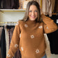 Bring a pretty touch to your everyday wardrobe with the Mocha Flower Embroidered Sweater by Bibi. The mocha shade makes an easy starting point for your outfit, while flower embroidery adds detail and personality. A classic crew neckline keeps the look simple, letting the floral accents have their moment.

Picture a crisp afternoon, a coffee in hand, and this sweater paired with your favorite jeans. From browsing local shops to meeting friends for lunch, it brings a feminine twist to an easy sweater-and-deni