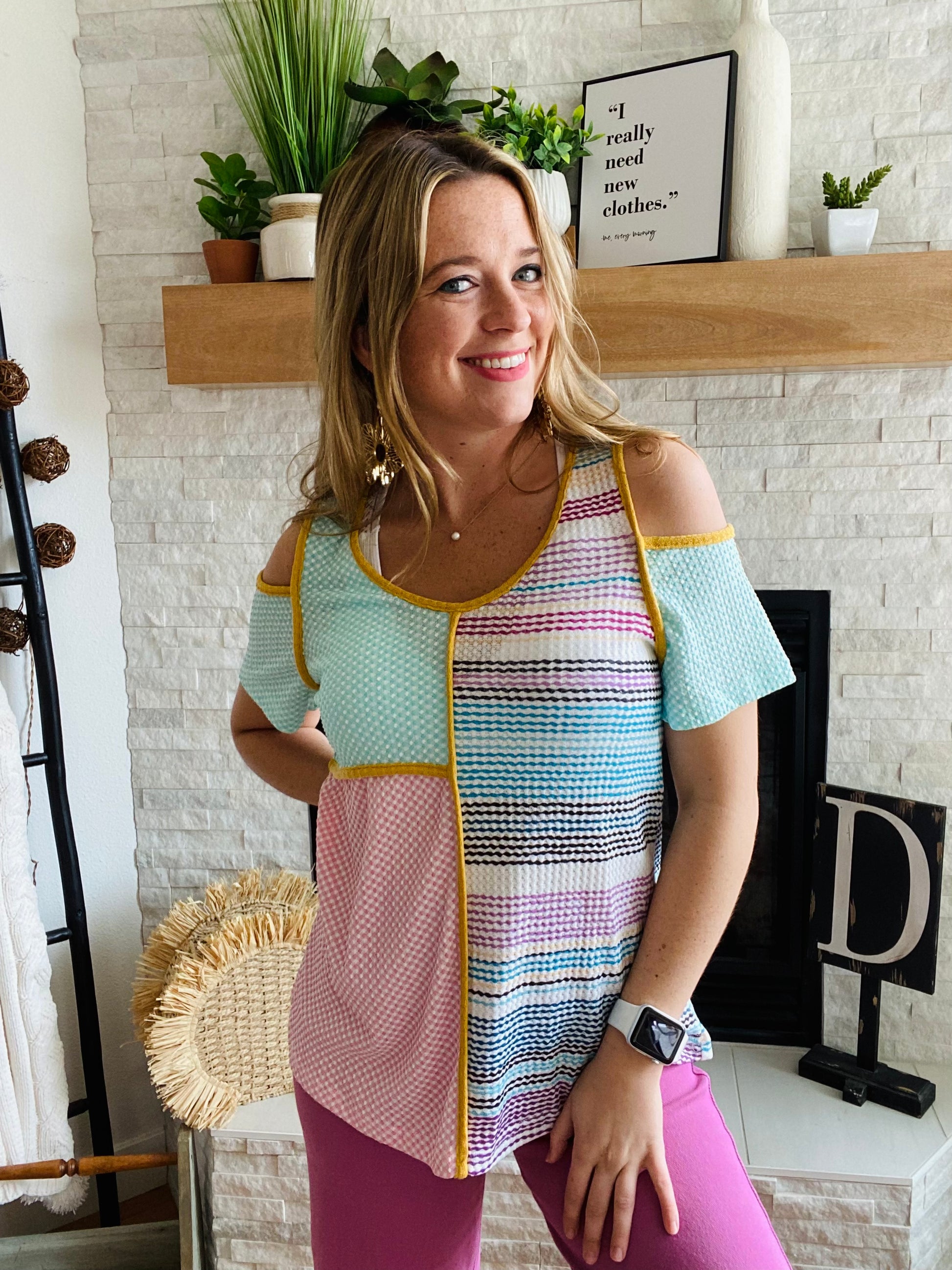 This Multi Contrast Cold Shoulder Short Sleeve blouse adds a vibrant touch to any wardrobe. In teal, pink, yellow, and purple shades, this top features a cold shoulder accent and reversed hemline for a unique look. It is true to size, ensuring a comfortable fit.